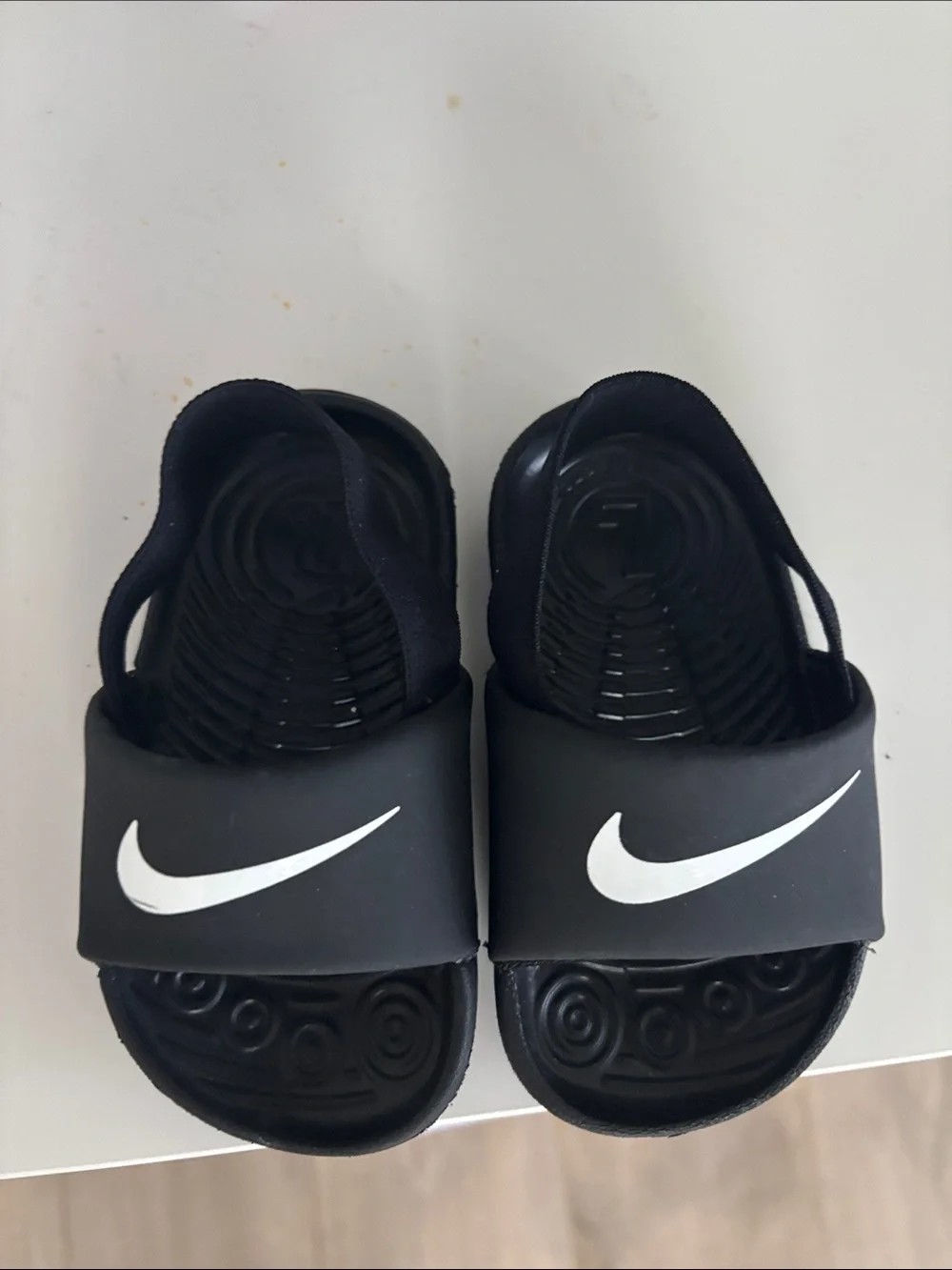 Nike Kids Black Slide Sandals with White Swoosh Accent